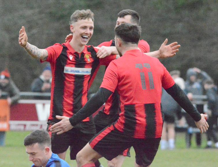 Will Haworth celebrates scoring against Hakin United